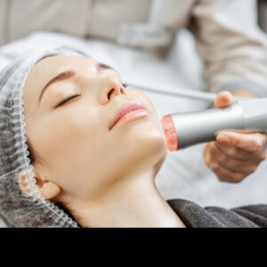 woman during the facial treatment at the beauty salon