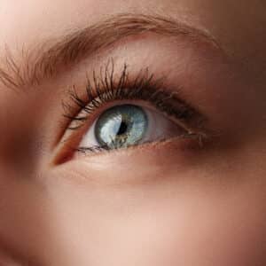 close up of young female blue eye